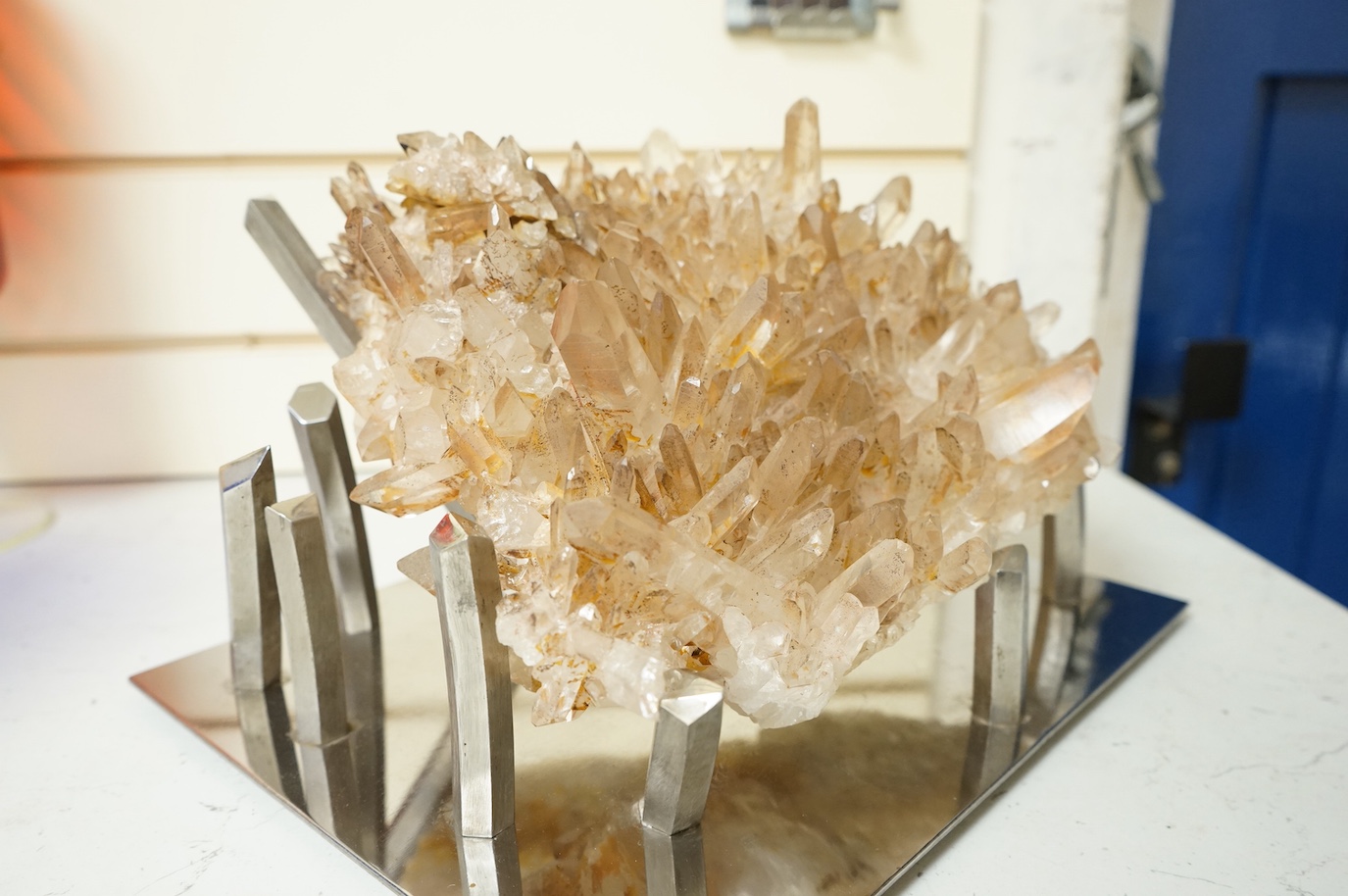A large quartz specimen on bespoke chrome stand, stand 32cm wide x 26cm deep. Quartz 28cm wide x 27cm deep